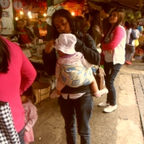 KID AND THE MOTHER - Photographed at the Baguio City Market. Best way to watch a kid is to take him along, as she does her marketing.